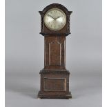 An oak miniature long case clock, with brass German movement of drum form, over wound, 42.5 cm high