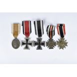 A collection of German WWI and WWII medals, comprising the Iron Cross 1914-15, the Cross of Honour