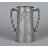 A Liberty & Co pewter Tudric loving cup, designed by David Veazey with Honesty plants and motto 'For