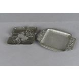 Two Tudric pewter art nouveau pin trays, including a twin handled hammer beaten example with