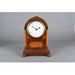 An early 19th Century Sedan clock, the mahogany walnut and crossbanded case of domed form on brass