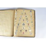 A collection of Regimental Coat of Arms letter heads, loose and stuck down in a folder, comprising