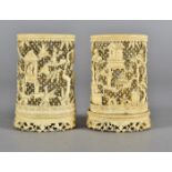 A pair of 19th Century Chinese ivory carved and pierced sleeve vases, with prunus trees and
