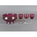 A pair of 19th Century cranberry bowl wine glasses,