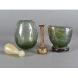 A Roman iridescent glass vase, with hardwood stand, a Whitefriars optic moulded ovoid vase an