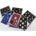 A collection of coins and stamps, with several UK proof sets, several possibly Russian bank notes,