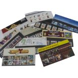 A collection of vintage and modern stamps, including several Royal Mail Mint Stamps sets, other face