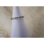 An Art Deco period platinum and diamond full eternity ring, eight cuts, AF, 2.2g and size M