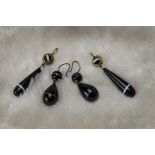 Two pairs of Victorian bulls eye agate earrings, one pair with long pear shaped drop with gilt