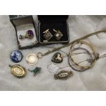 A collection of 19th and 20th century jewellery, including a mourning locket opening to reveal