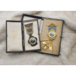 Two 1920s Masonic jewels, one in 9ct gold, the other in silver, both with enamel panel for Harlow