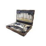 A canteen of Art Deco period silver plated cutlery by George Butler, in an oak canteen with