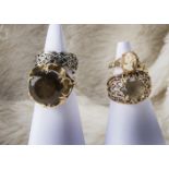 A group of seven gold and other rings, including one smoky quartz dress ring, two cameo examples,