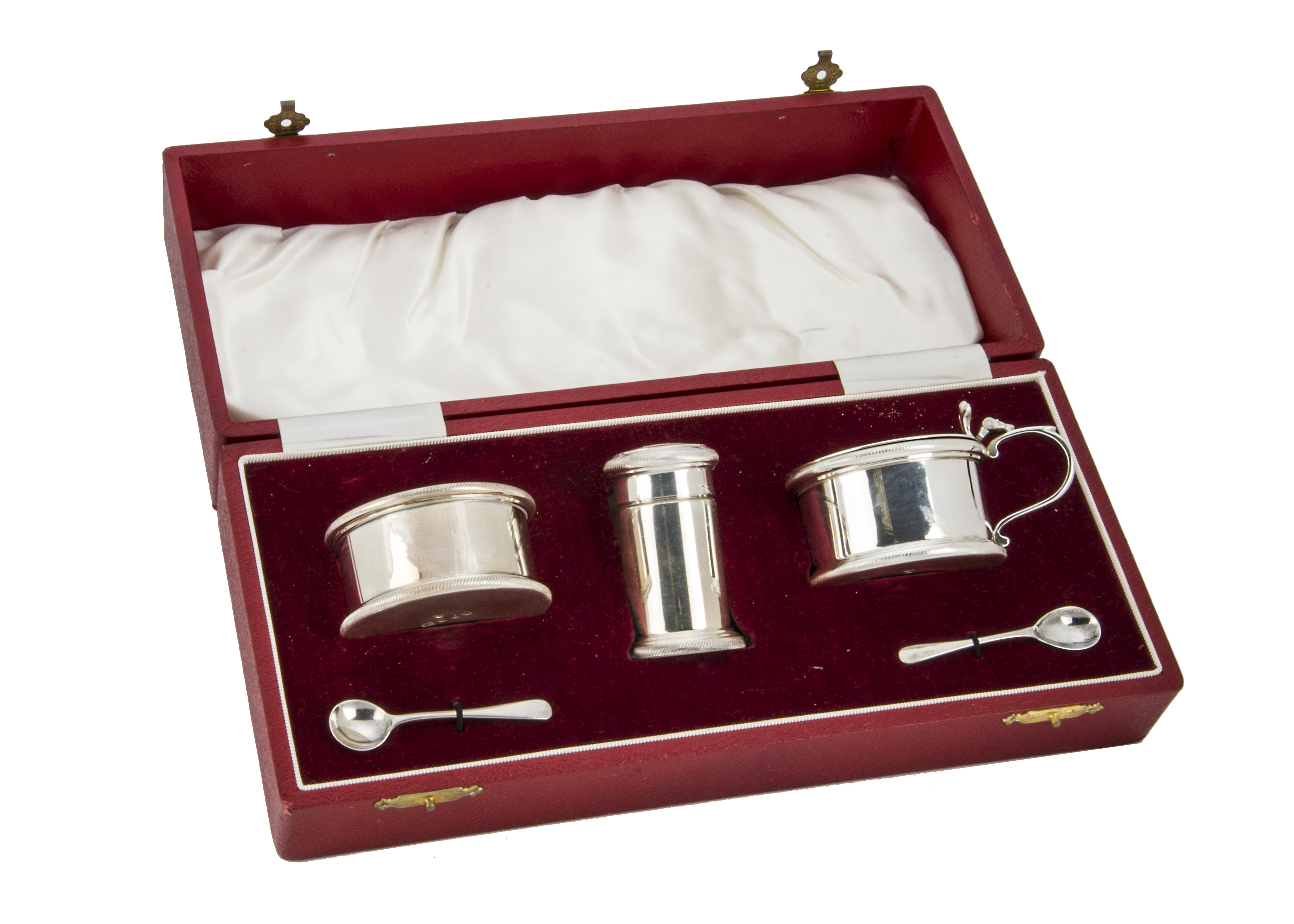 A cased 1970s three piece silver cruet set by EB, in red box housing mustard, salt, pepper and two