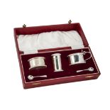 A cased 1970s three piece silver cruet set by EB, in red box housing mustard, salt, pepper and two