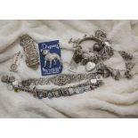 A collection of silver and other jewellery, including several filigree bracelets and charms