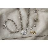 Five modern silver and gold items of jewellery, including a Tiffany & Co silver necklace by Elas