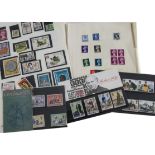 A collection of 1950s and later British stamps, some in an album, most loose, three presentation