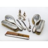 A cased Edwardian silver caster by Charles Stuart Harris, together with a silver pepper, a five
