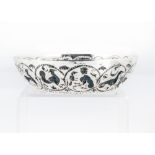 A vintage continental silver dish, with raised designs including animals in roundels, marked BM