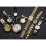 A group of eight watches, including a modern 9ct gold cased Sovereign lady's wristwatch, a Smiths
