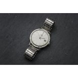A 1960s Bucherer stainless steel gentleman's wristwatch, silvered dial with date aperture, 35mm,