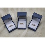 Three 9ct gold and gem set rings from Rocks & Co, all with certification, one with five opals, and