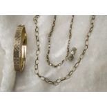 Four items of 9ct gold jewellery, including a bangle, two chain necklaces and an eternity ring,