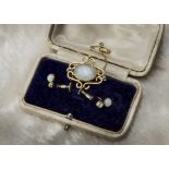 A 9ct gold brooch, together with a pair of gold and opal earrings, with a box (4)