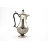 A Victorian silver hot water jug from Walker & Hall, bulbous body with raised fluted lower on
