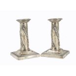A pair of late Victorian silver filled candlesticks by TB