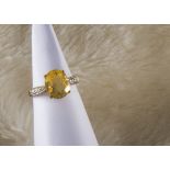 A modern 9ct gold fire opal ring, heightened by diamonds to shoulders, 2.7g and size N