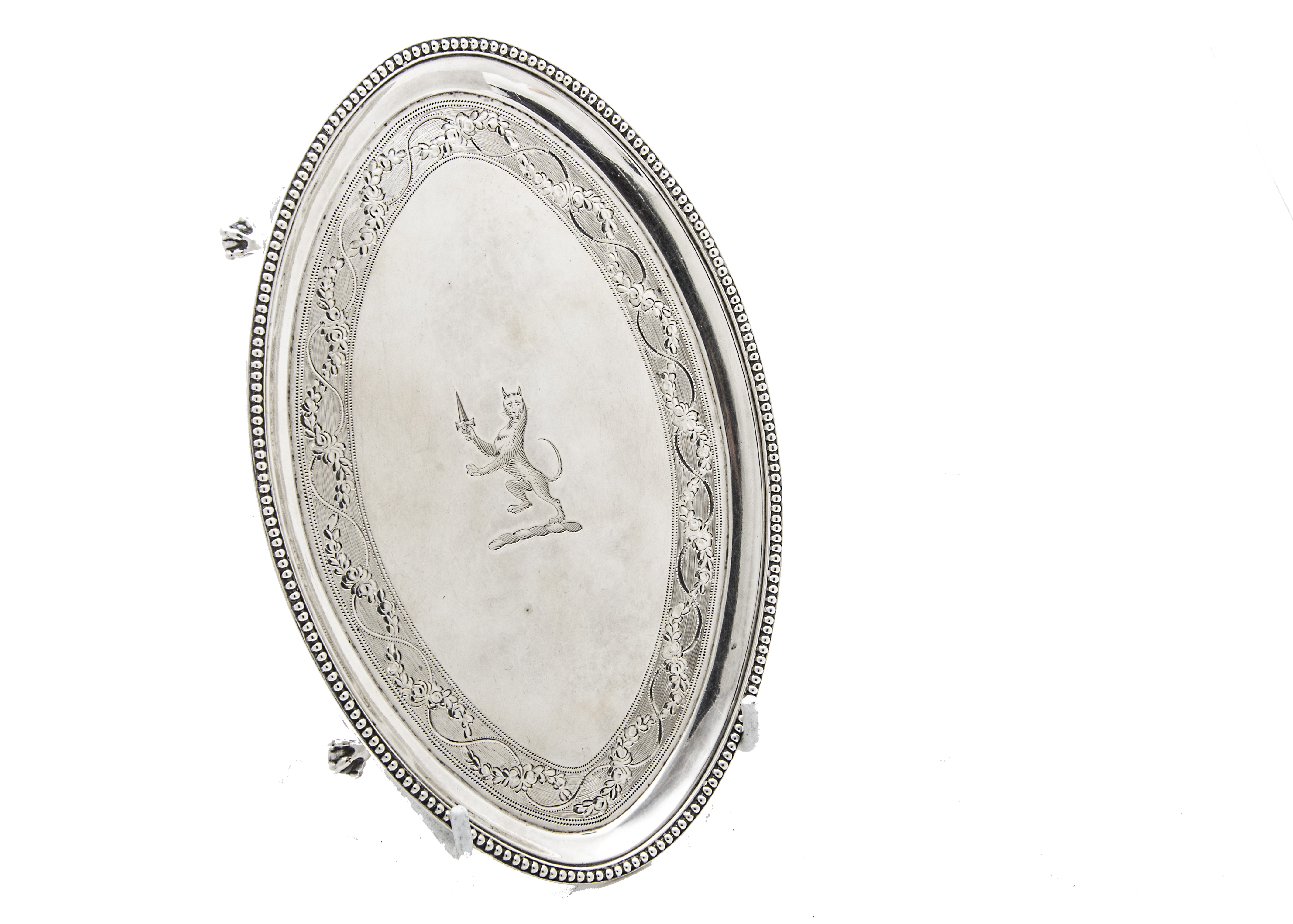 A George III silver teapot stand by John Crouch I & Thomas Hannam, oval form with bead rim, engraved