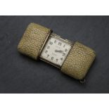 An Art Deco period Movado silver gilt and shagreen purse watch, the ray skin double slide case