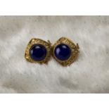 A pair of 1980s 18ct gold and lapis lazuli earrings, the cushion shaped pierced mounts with a