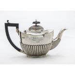 A late Victorian silver teapot, with fluted lower, possibly Charles Stuart Harris, with later