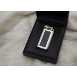 A modern silver plated and black lacquer cigarette lighter by Dunhill, 483792, in Dunhill box (2)