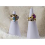 A group of five Middle Eastern yellow metal and gem set rings, one with oval cut pink stone, another