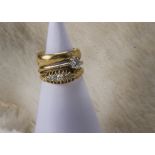 A group of three antique and vintage 18ct gold rings, including a solitaire, a five stone and a