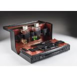 An Art Deco period gentleman's travel dressing set from Asprey & Co, the black leatherette case