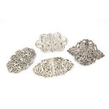 A group of 4 Victorian and modern silver nurses buckles, one now converted to a brooch, another with