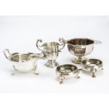 Five items of silver, including a pair of George III cauldron salts, an Art Deco presentation