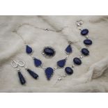 An associated modern suite of white metal and lapis lazuli jewellery, including a bracelet, a fringe