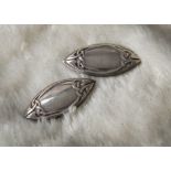 A pair of 1980s silver earrings from Liberty & Co, Celtic design to elliptical panels with clip