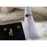 A suite of modern 9ct gold and black star sapphire jewellery from Rocks & Co, comprising pendant,