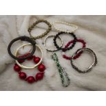 A collection of costume and fashion jewellery, including many bead necklaces, bangles, bracelets and