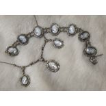 An early 20th century German silver and cameo fringe necklace and bracelet set