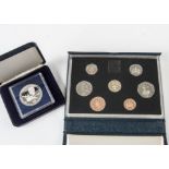 A collection of modern proof sets and coins, including several cased UK and related proof sets, a