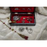 A collection of jewellery and other items, including a silver thistle brooch and necklace, two