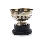 An Edwardian silver footed bowl, with fluted lower, bent at base, Sheffield 1903, 6.4 ozt, with a